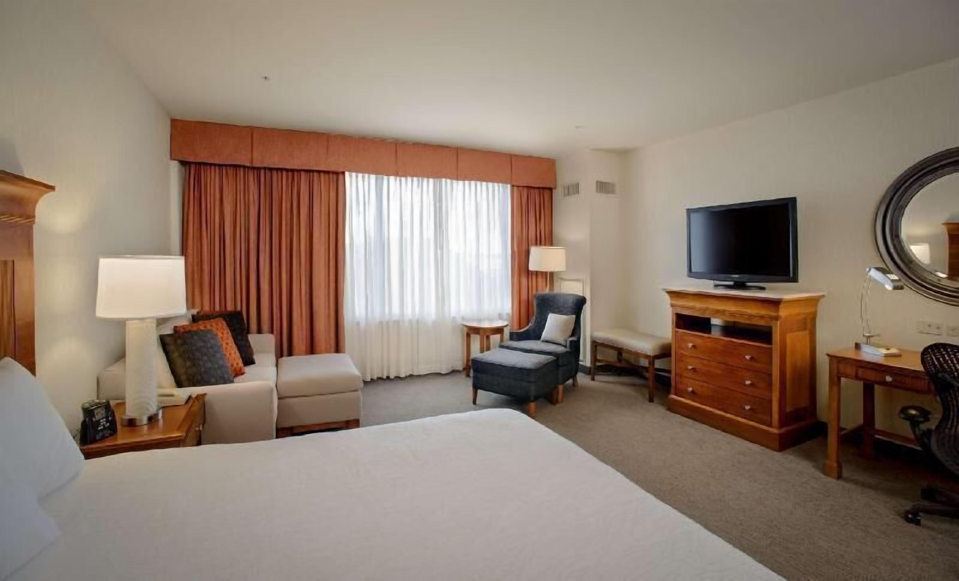 Hypo-allergenic bedding, desk, laptop workspace, blackout curtains