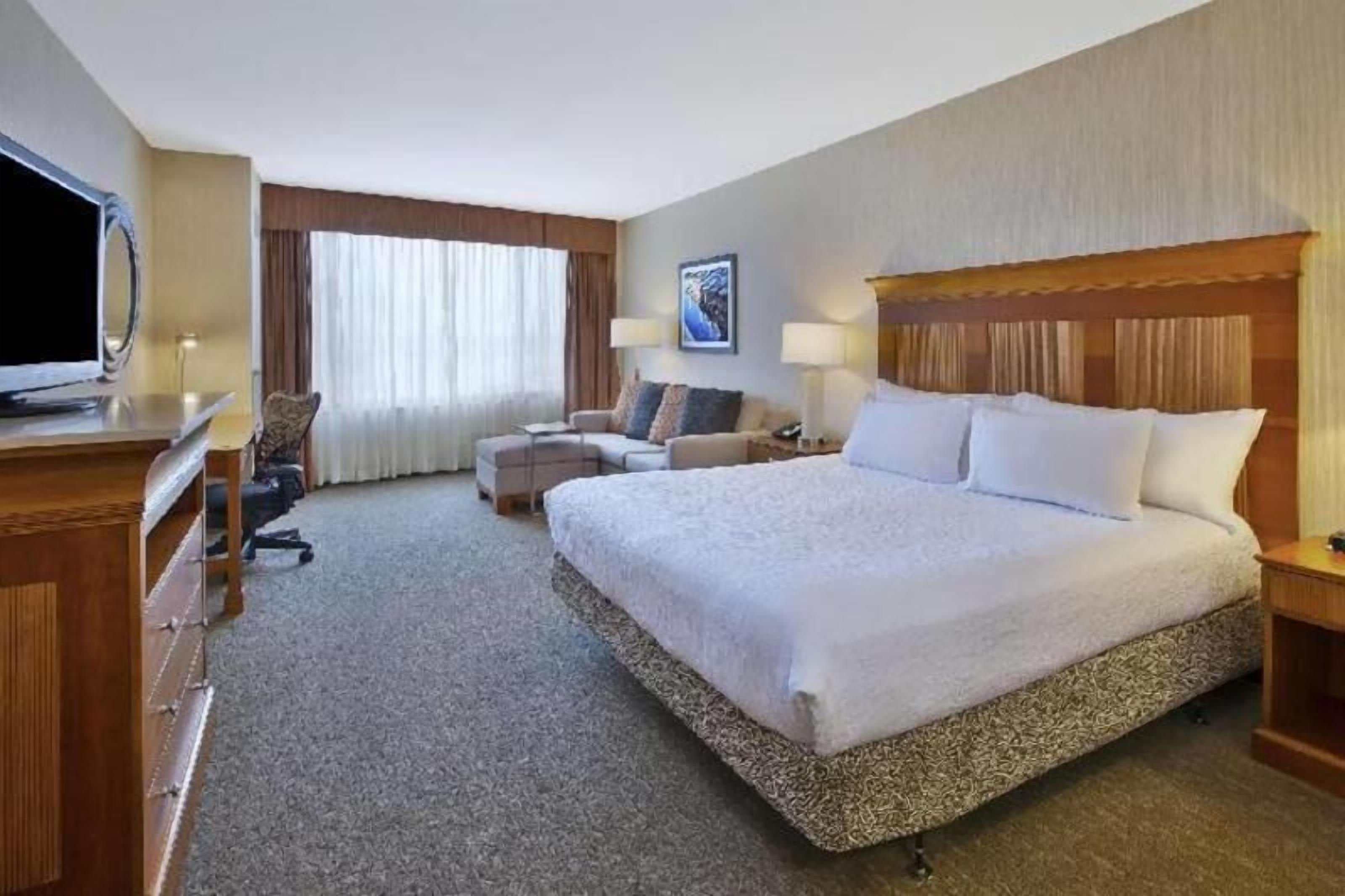 Hypo-allergenic bedding, desk, laptop workspace, blackout curtains
