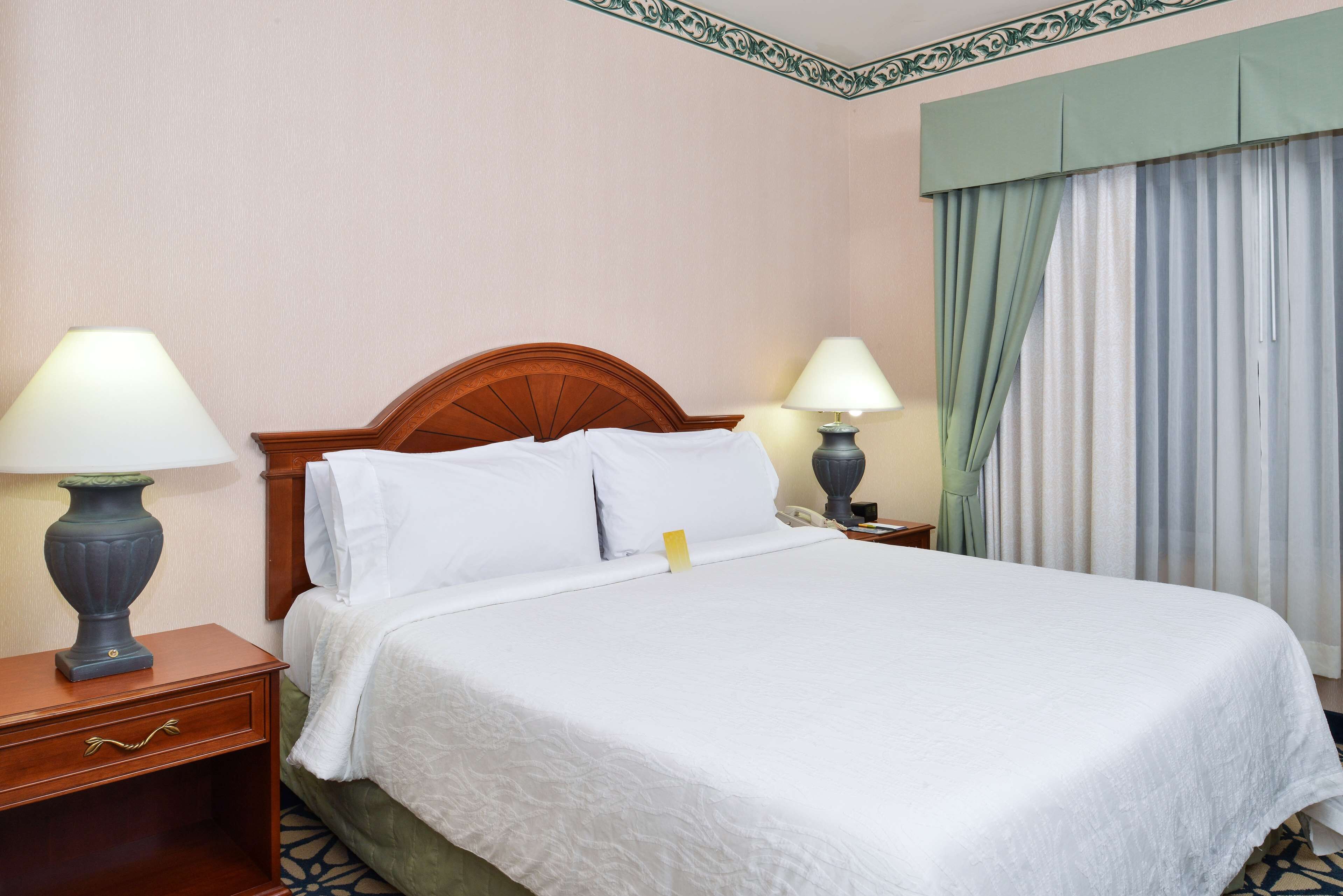 room | desk, laptop workspace, blackout curtains, iron/ironing board