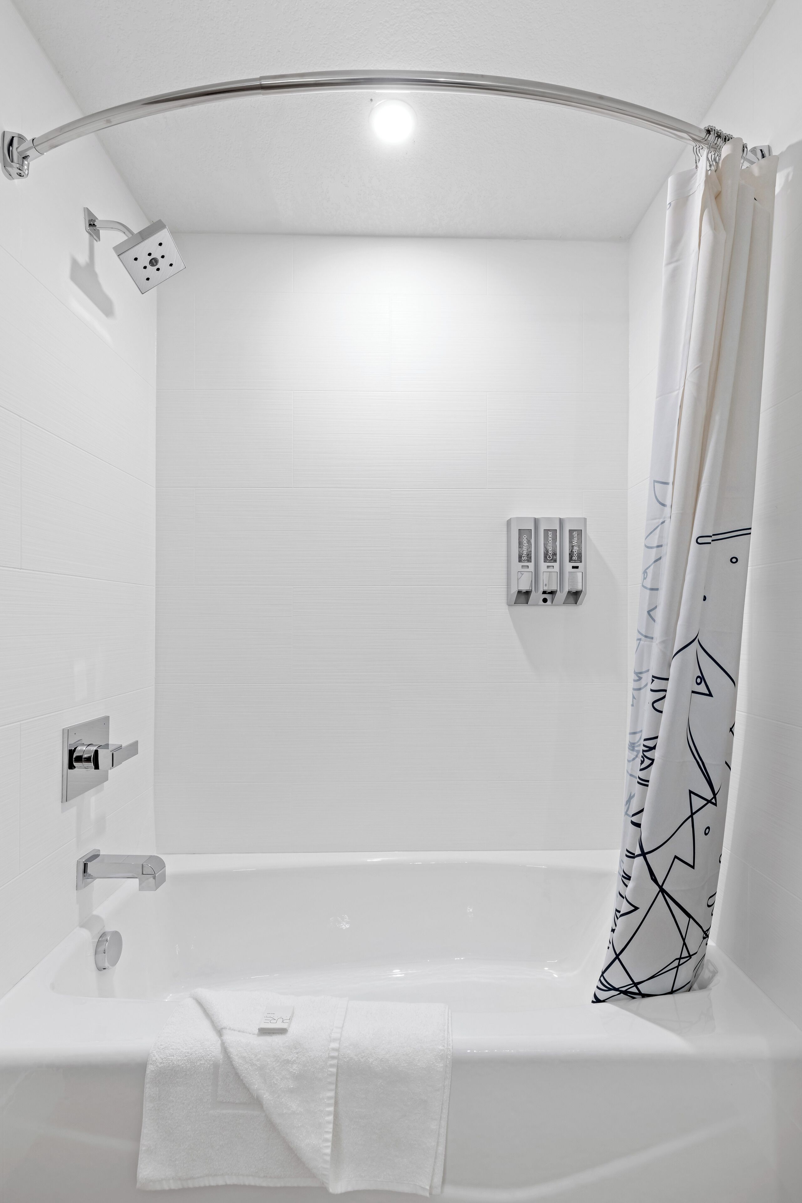 bathtub, hair dryer, towels