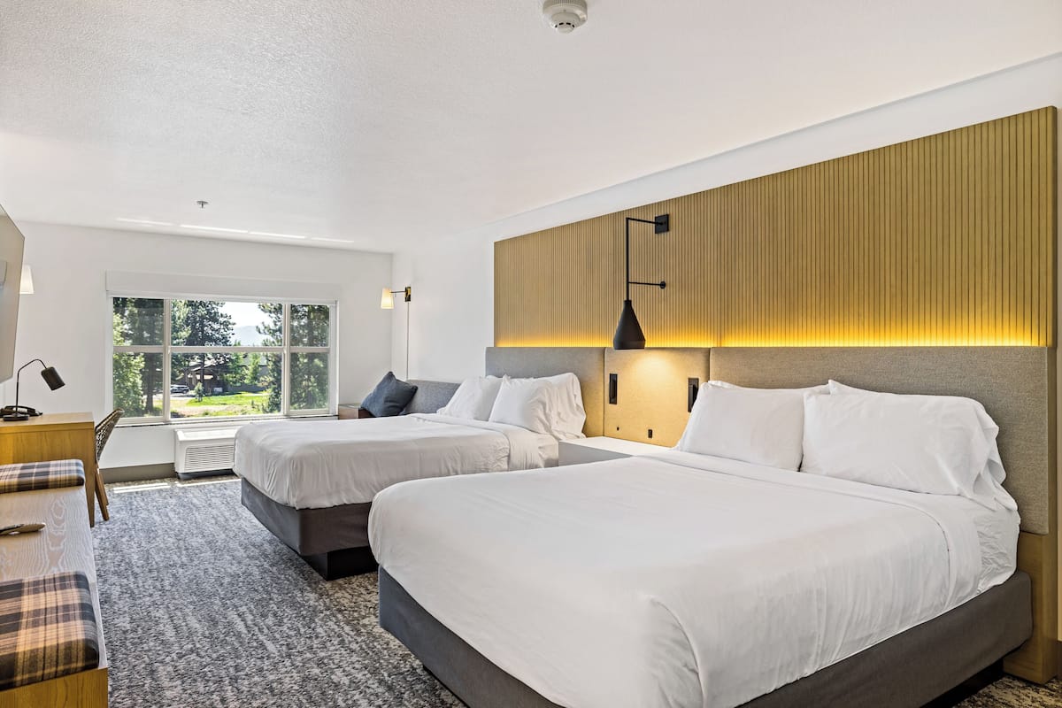 Standard Two Queen - Sitting Area | Laptop workspace, iron/ironing board, free WiFi, bed sheets