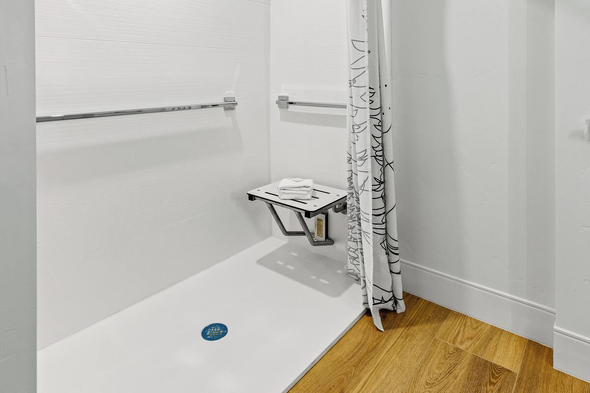 bathtub, hair dryer, towels