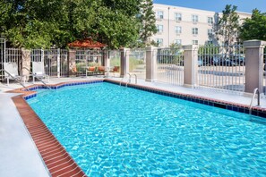Seasonal outdoor pool, open 1:00 PM to 8:00 PM, pool umbrellas