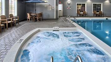 Indoor pool, open 8:00 AM to 11:00 PM, pool loungers