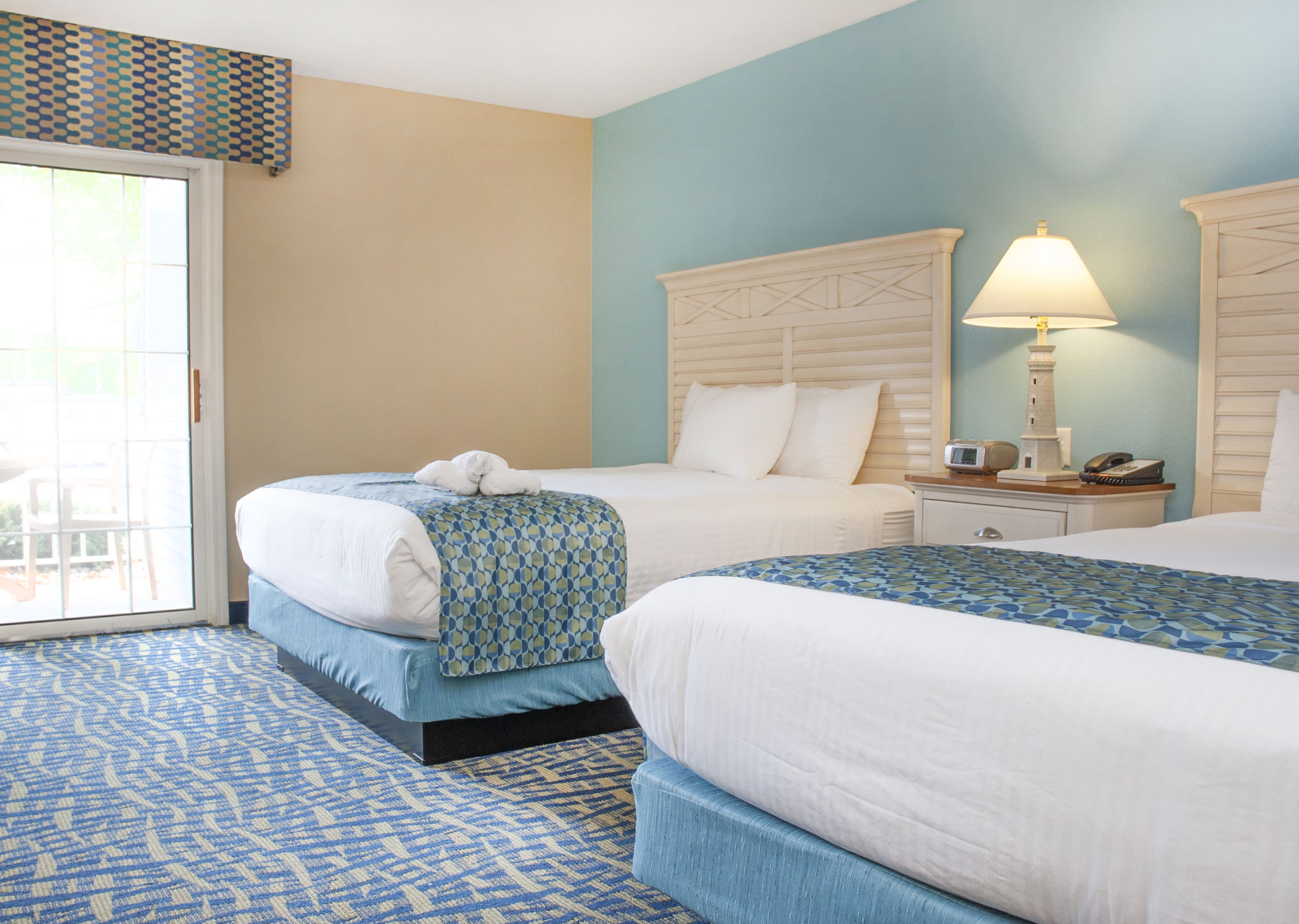 standard room, beach view (1 king and 1 queen bed - 1st floor) | premium bedding, in-room safe, desk, iron/ironing board