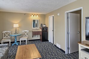 Family Suite, Multiple Beds, No View | Living area | 32-inch flat-screen TV with satellite channels, TV