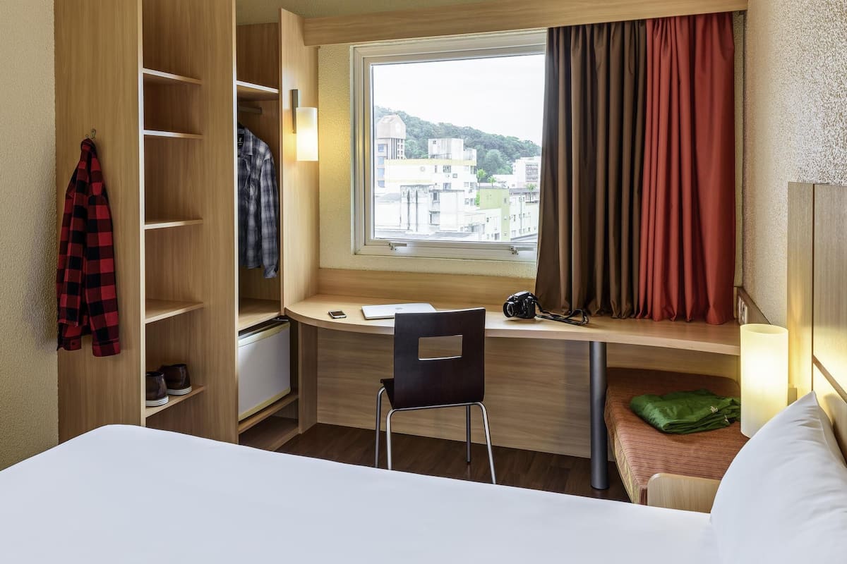 Desk, laptop workspace, blackout curtains, soundproofing