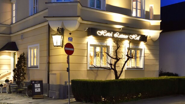 A hotel with a classic European architectural style, featuring multiple gables and a prominent sign. - Hotel Laimer Hof Nymphenburg Palace Munich (Munich)