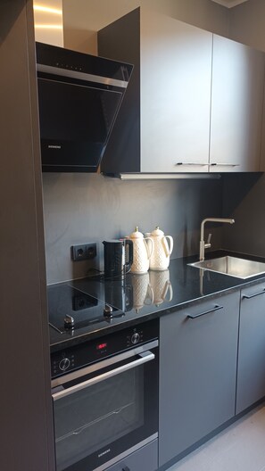 Comfort Apartment | Private kitchen | Fridge, microwave, stovetop
