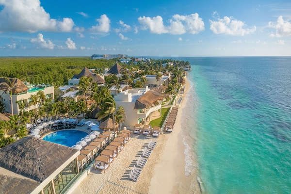 On the beach, white sand, beach umbrellas, beach towels