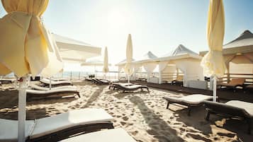 On the beach, sun-loungers, beach towels
