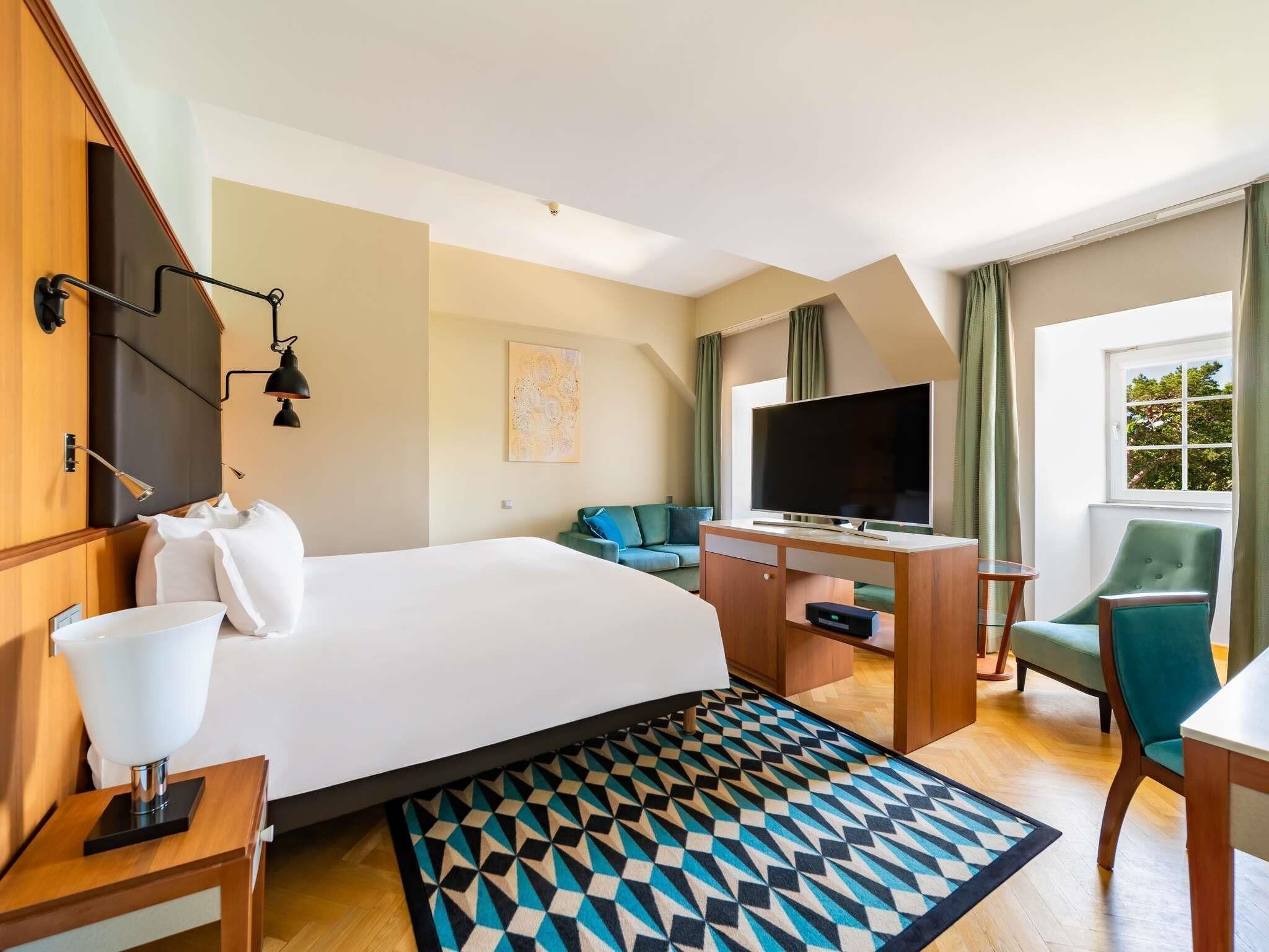 Suite Junior, 1 lit double, vue sur le parc | Literie de qualité, minibar, coffre-fort, bureau