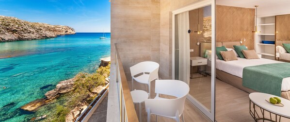 A balcony with a clear view of the sea, a bed with a green bedspread, and a small table with two chairs. - Globales Don Pedro Adults Only +16 (Pollensa)