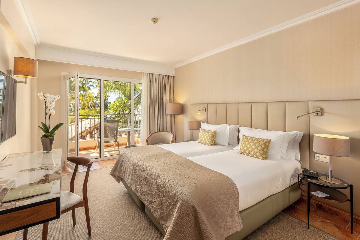 Standard Double Room | Minibar, in-room safe, desk, blackout drapes