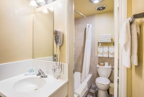 Double Room (1 Queen and 1 Double bed) | Bathroom | Combined shower/tub, free toiletries, hair dryer, towels