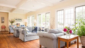A cozy living room with a sofa set, a wooden coffee table, and a potted plant. - Dunes on the Waterfront (Ogunquit)