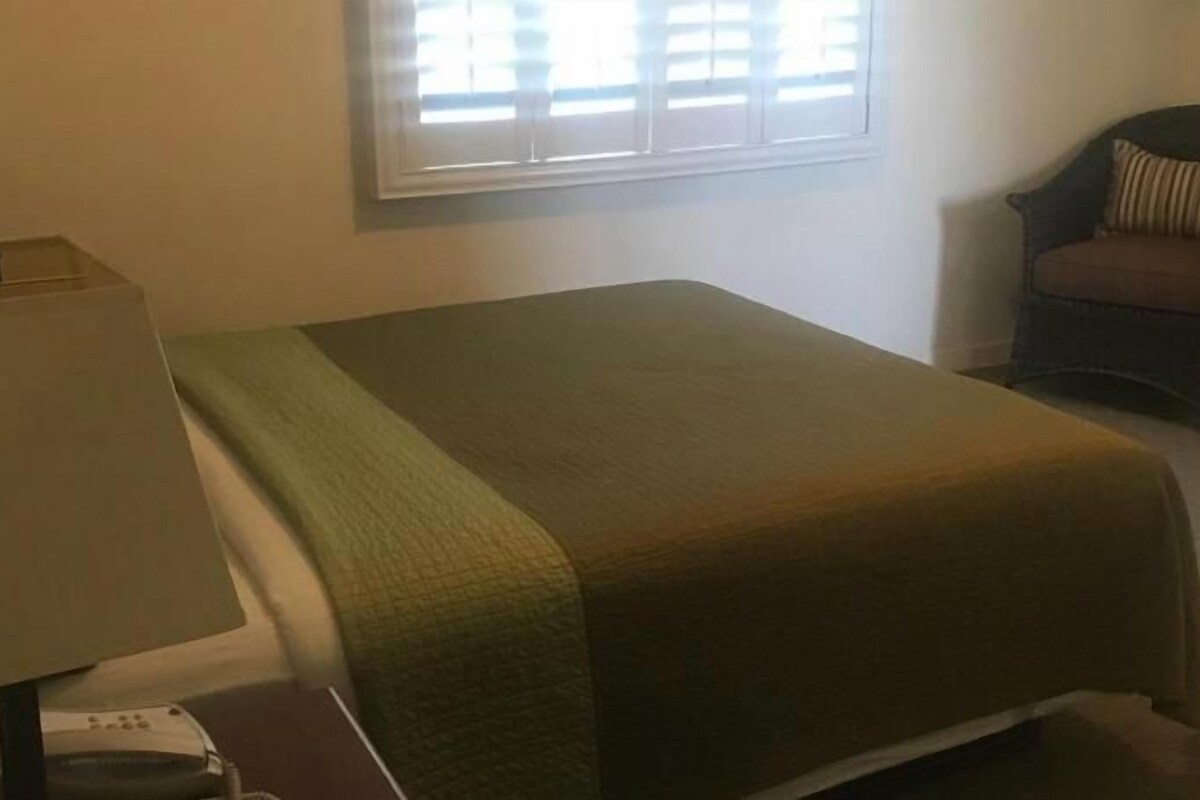 Premium bedding, blackout curtains, iron/ironing board, free WiFi