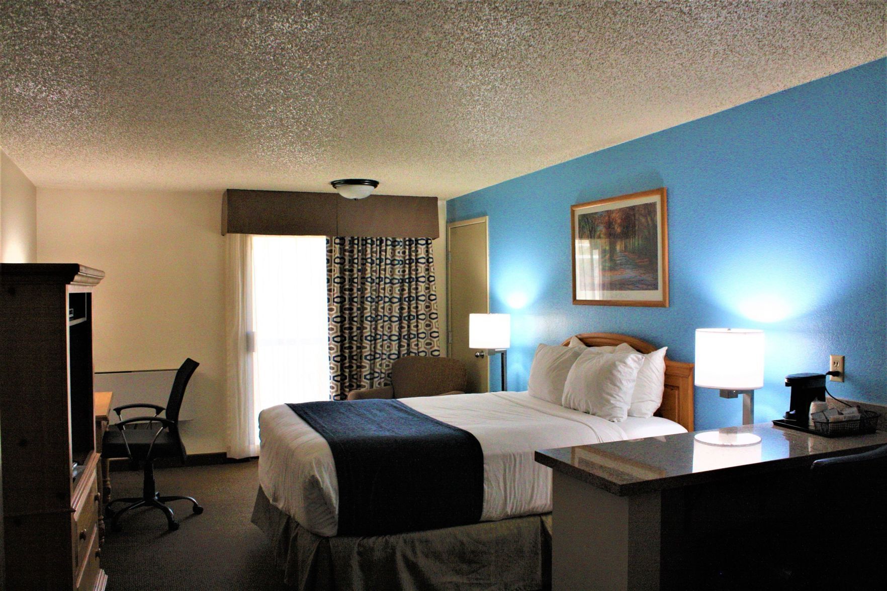 Premium bedding, desk, blackout curtains, iron/ironing board