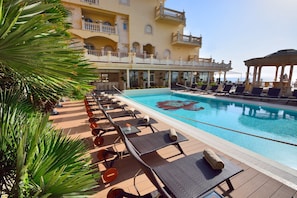 Seasonal outdoor pool, pool umbrellas, pool loungers