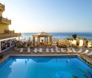 Seasonal outdoor pool, pool umbrellas, pool loungers