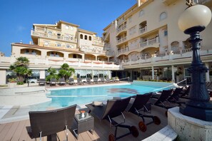 Seasonal outdoor pool, pool umbrellas, pool loungers