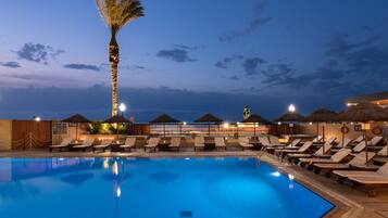 Outdoor pool, open 9 AM to 7 PM, pool umbrellas, sun loungers