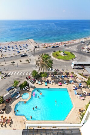 Outdoor pool, open 9 AM to 7 PM, pool umbrellas, pool loungers