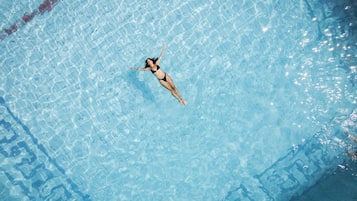 Outdoor pool, open noon to 5:00 PM, pool umbrellas, sun loungers