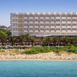 On the beach, white sand, sun loungers, beach umbrellas