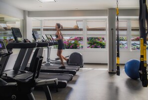 Work out in style with a variety of exercise equipment and a view of the lush outdoor area.
