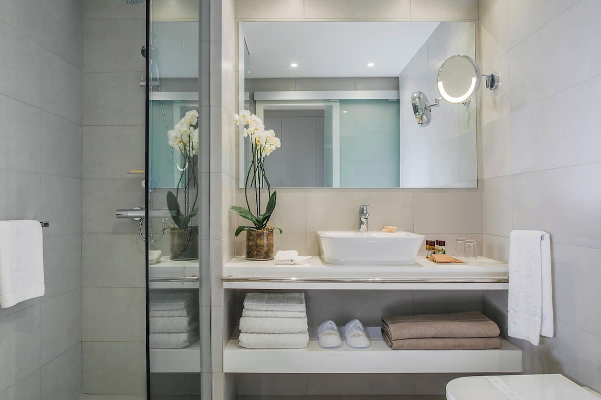 combined shower/bathtub, eco-friendly toiletries, hair dryer, bathrobes