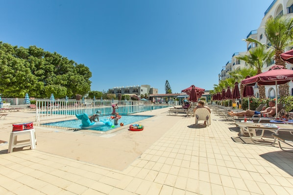 Outdoor pool, pool umbrellas, pool loungers