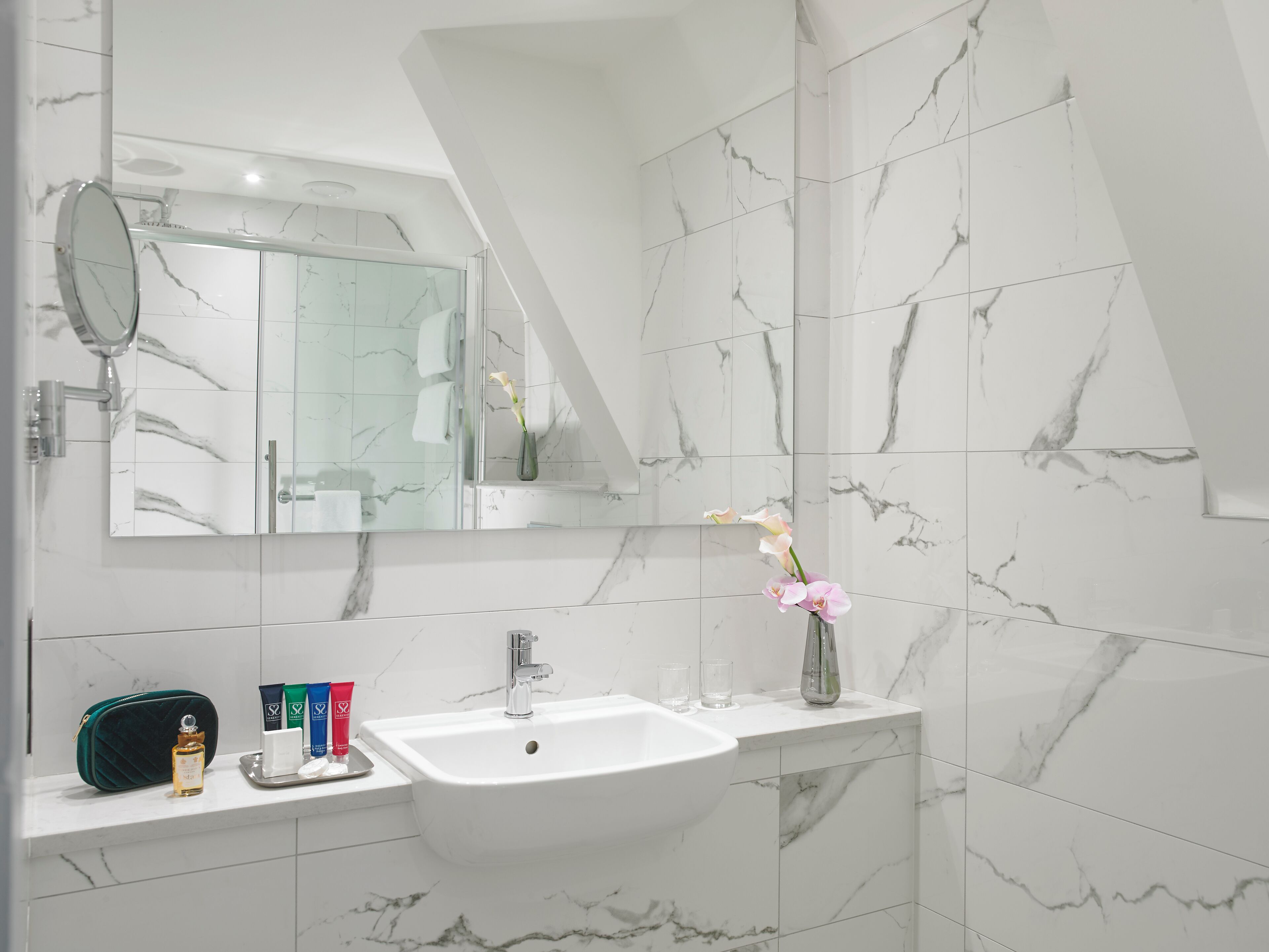 junior studio suite | bathroom | designer toiletries, hair dryer, towels, soap