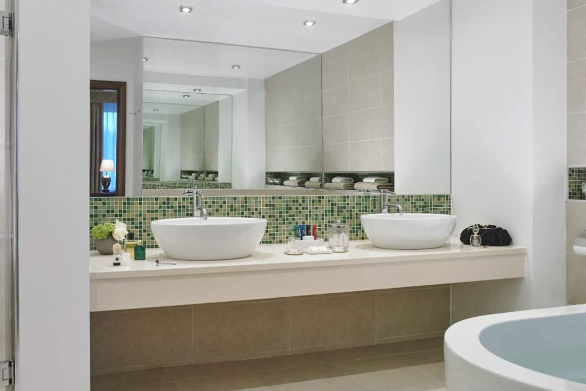 Classic Suite | Bathroom | Designer toiletries, hair dryer, towels, soap