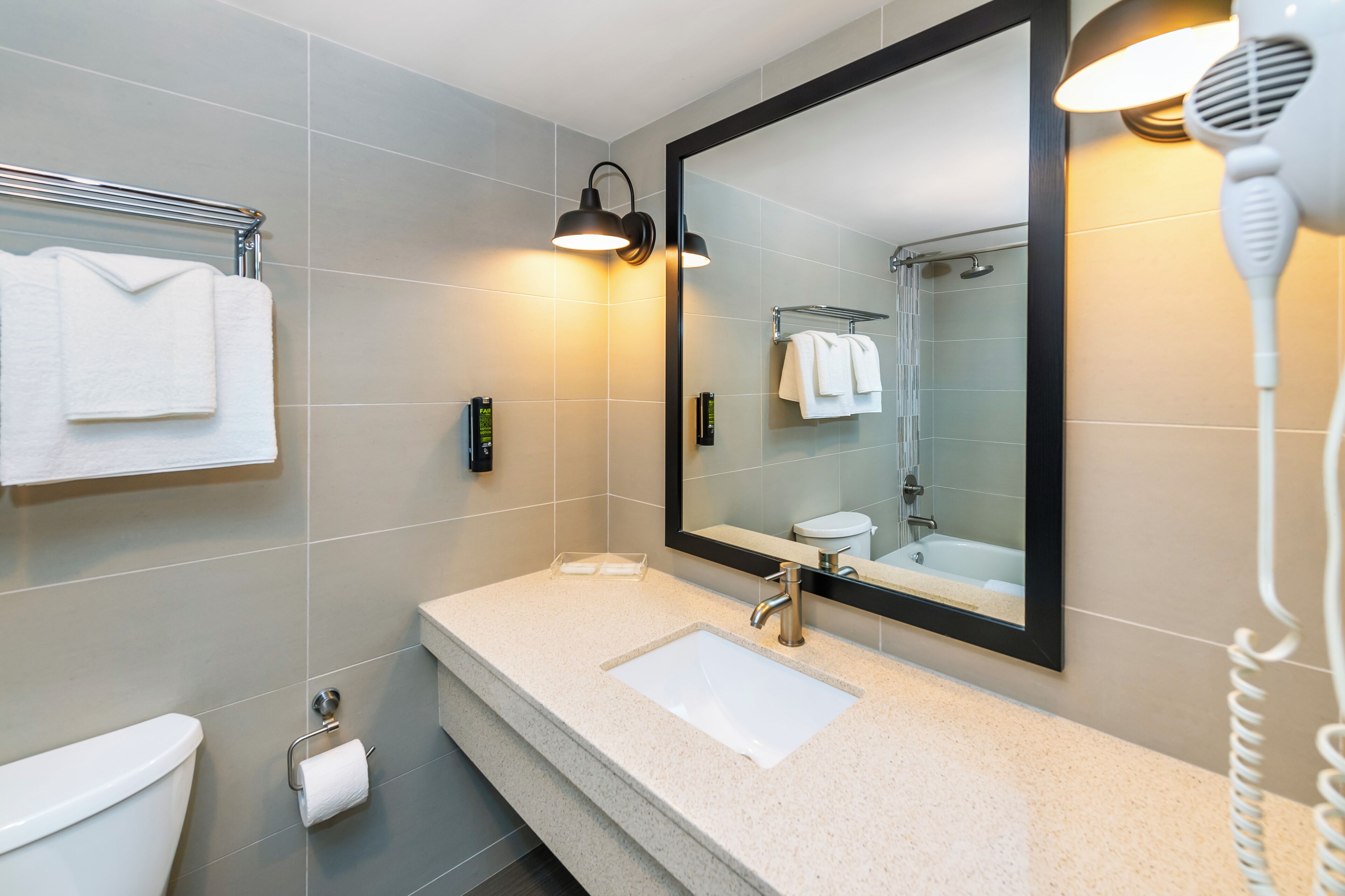 deluxe room, 1 king bed | bathroom | combined shower/bathtub, deep-soaking bathtub, free toiletries