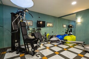 Stay fit on the go with our fully equipped gym featuring a weight machine, stationary bike, and rowing machine.