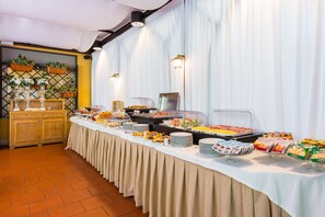 Enjoy a sumptuous spread at this hotel's buffet, featuring a variety of delicious food options.
