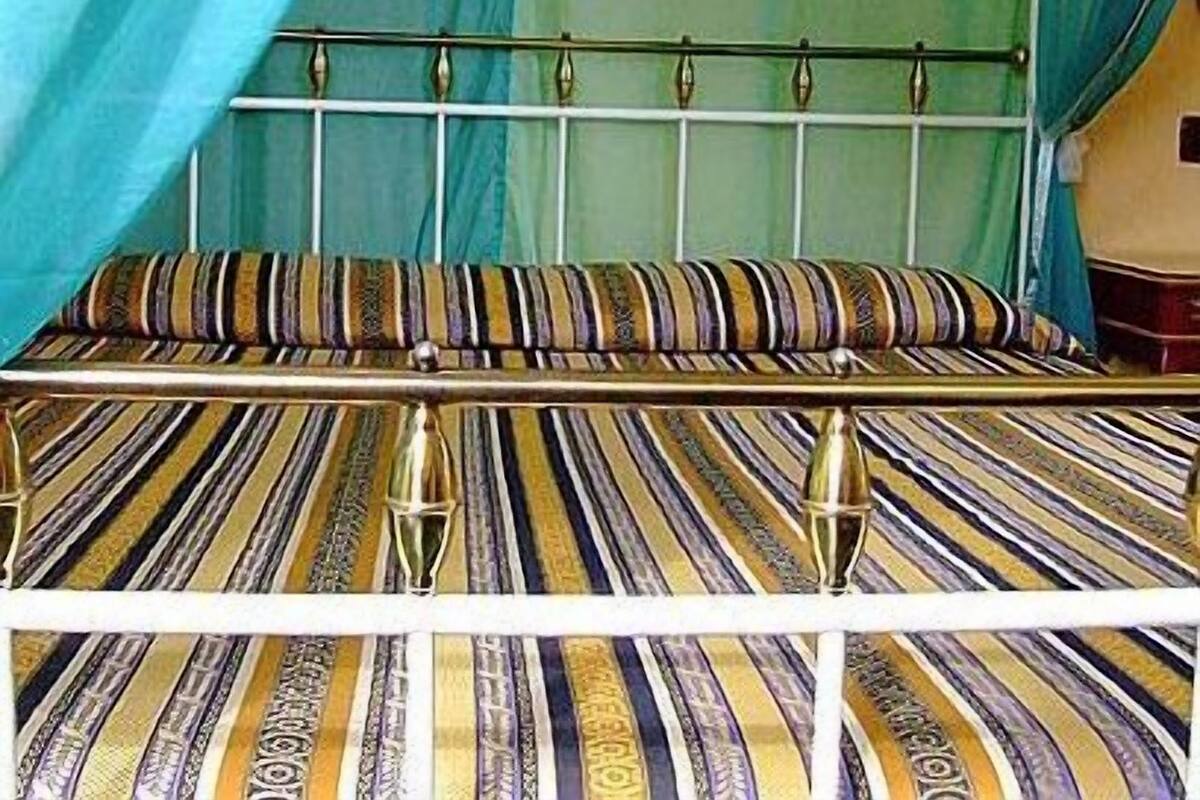 Economy Double Room | Minibar, in-room safe, iron/ironing board (on request)
