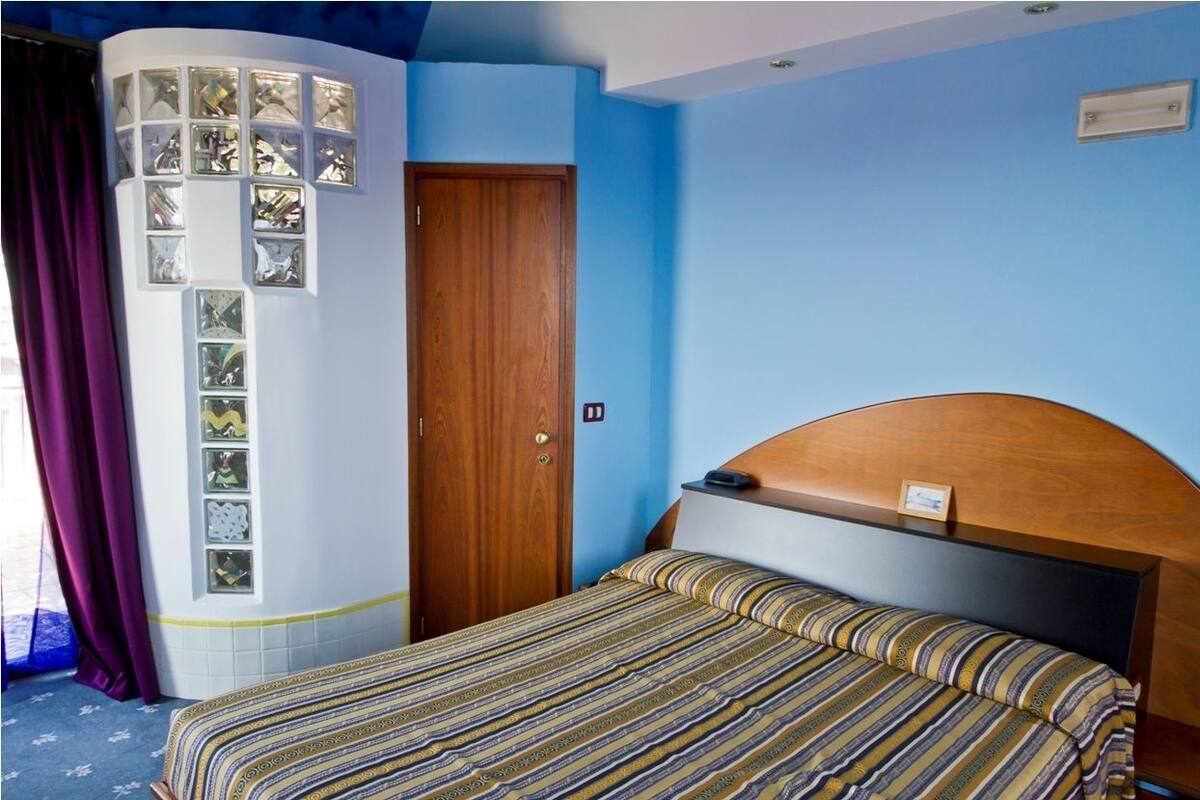Standard Triple Room | Minibar, in-room safe, iron/ironing board (on request)