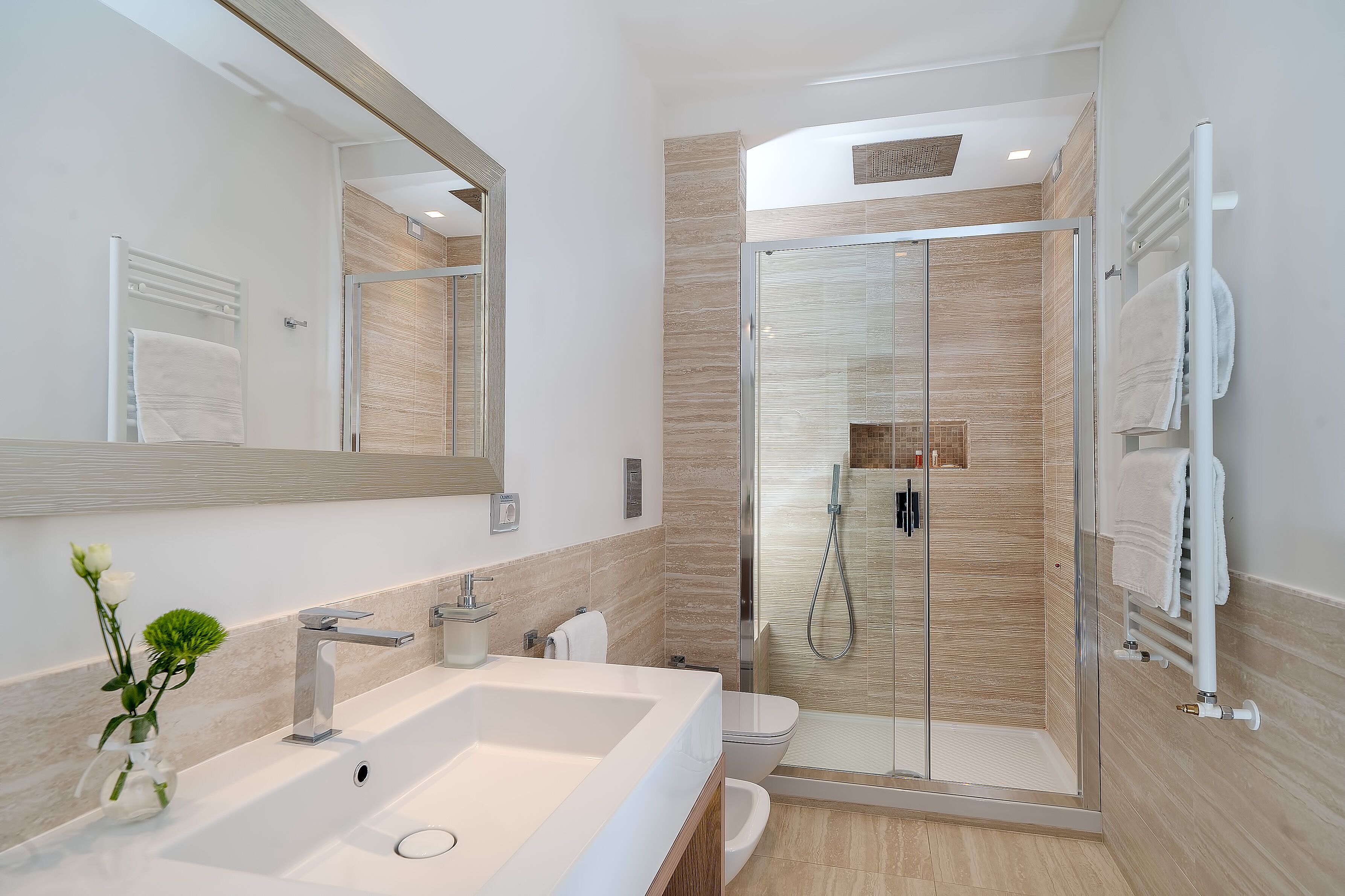 shower, hair dryer, bidet, towels