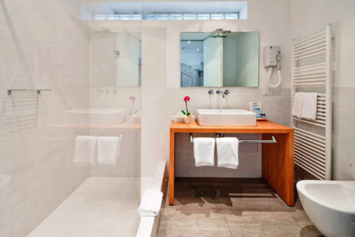 deluxe double room, private pati on the lake in villa, no lift | bathroom | hair dryer, slippers, towels, soap