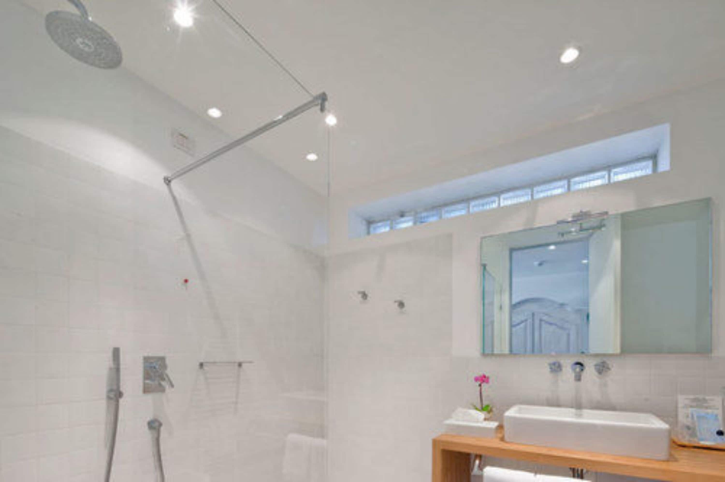 junior suite, lake view in villa, no lift | bathroom | hair dryer, slippers, towels, soap