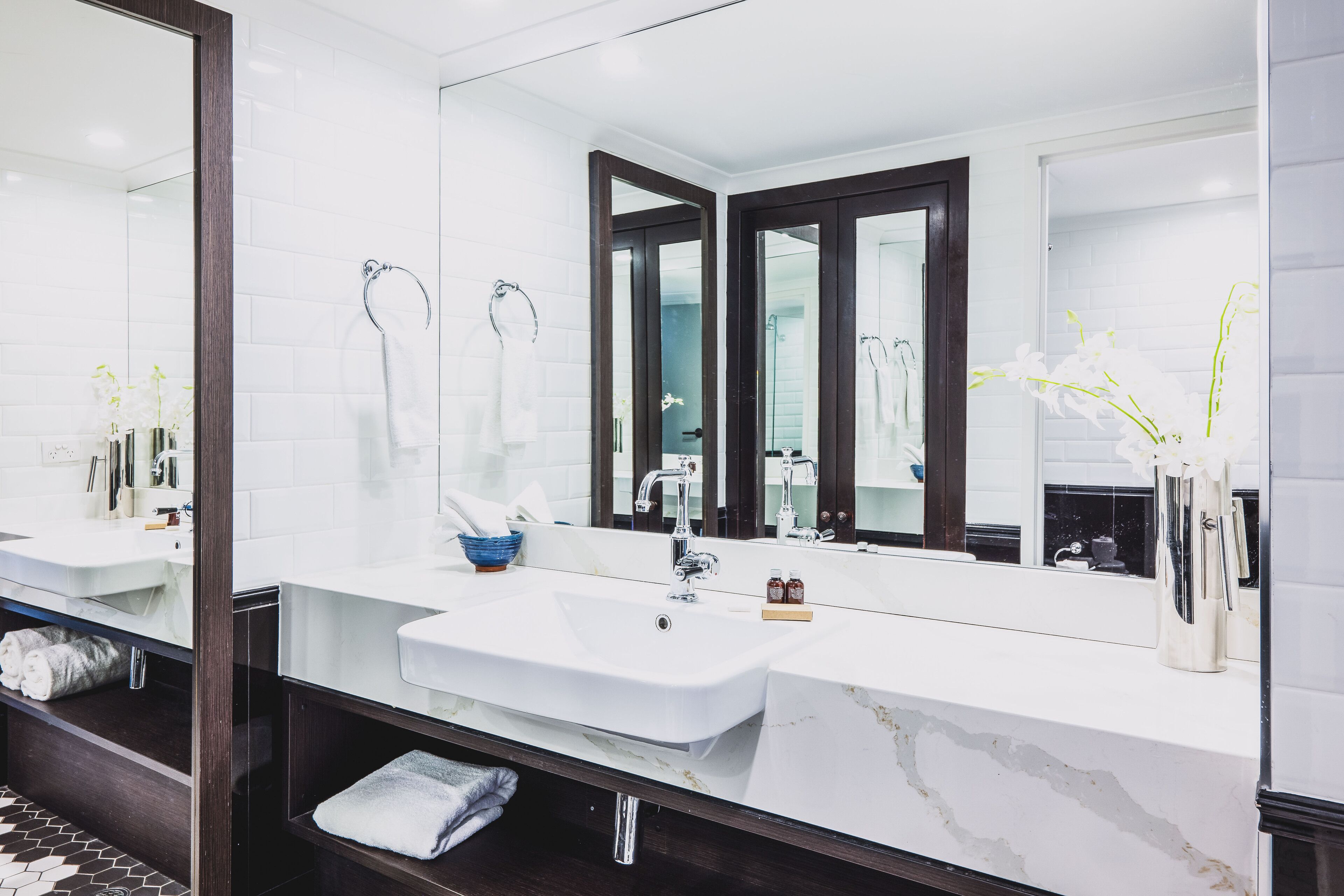 designer toiletries, hair dryer, bathrobes, slippers