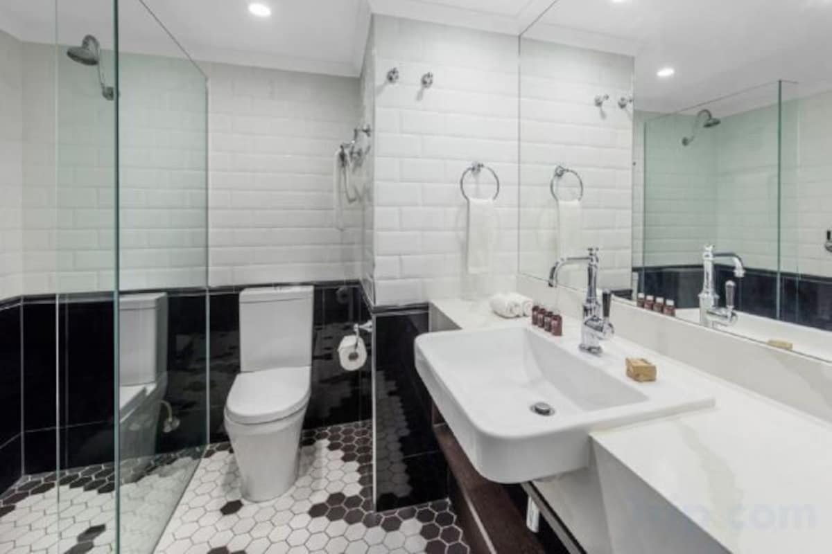 Designer toiletries, hair dryer, bathrobes, towels