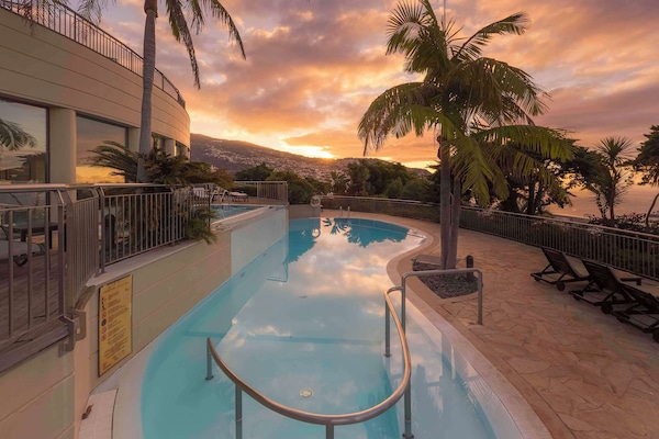 Indoor pool, outdoor pool, open 10:00 AM to 6:00 PM, pool umbrellas