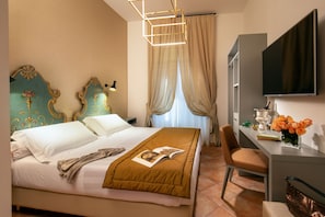 Double Room | Minibar, in-room safe, individually decorated, desk