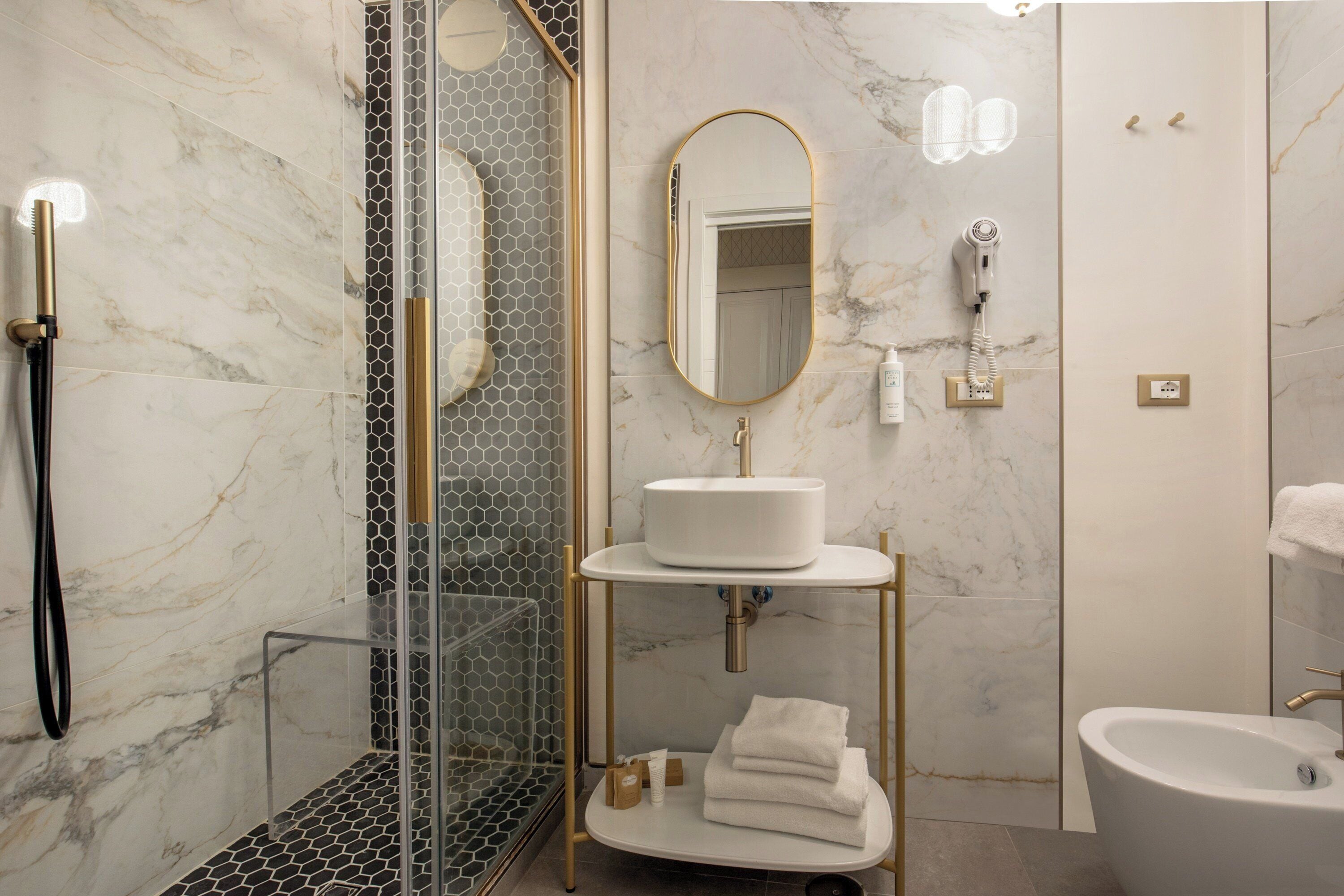 free toiletries, hair dryer, bidet, towels