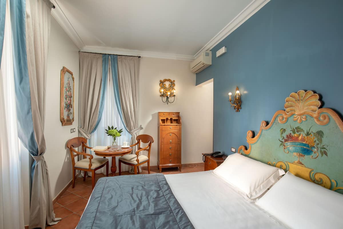 Superior Double Room | Minibar, in-room safe, individually decorated, desk