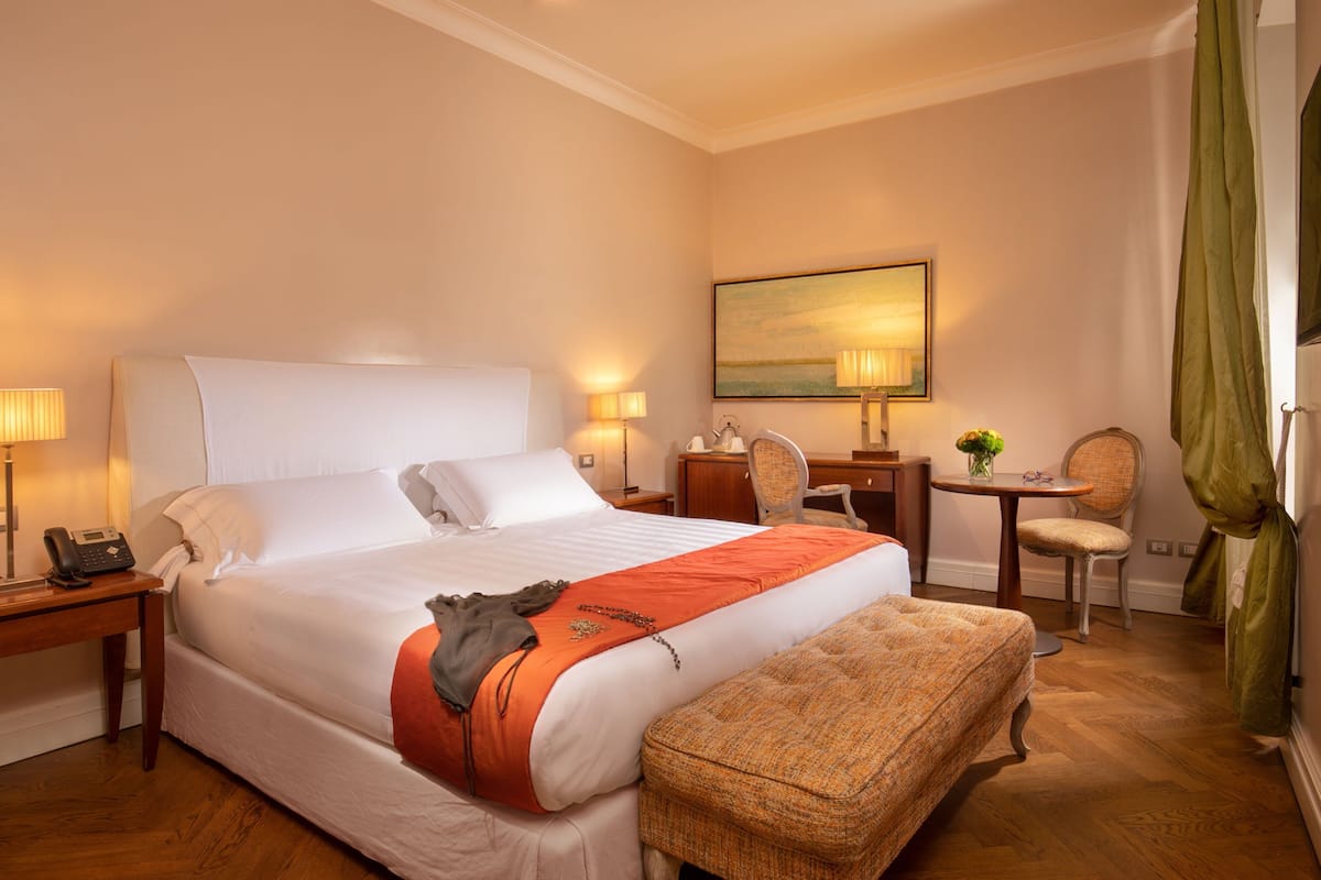 Elegance Double Room (annex building, via del Corso 75) | Minibar, in-room safe, individually decorated, desk