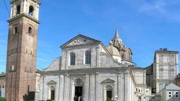 A historic church with a bell tower and a dome.